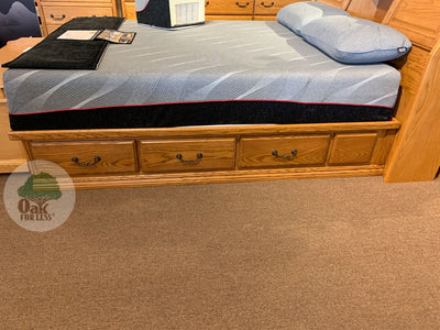 OD-O-T456 - Traditional Oak Pedestal Bed with 6 drawers pictured with a mattress and 2 pillows - side view - Oak For Less® Furniture